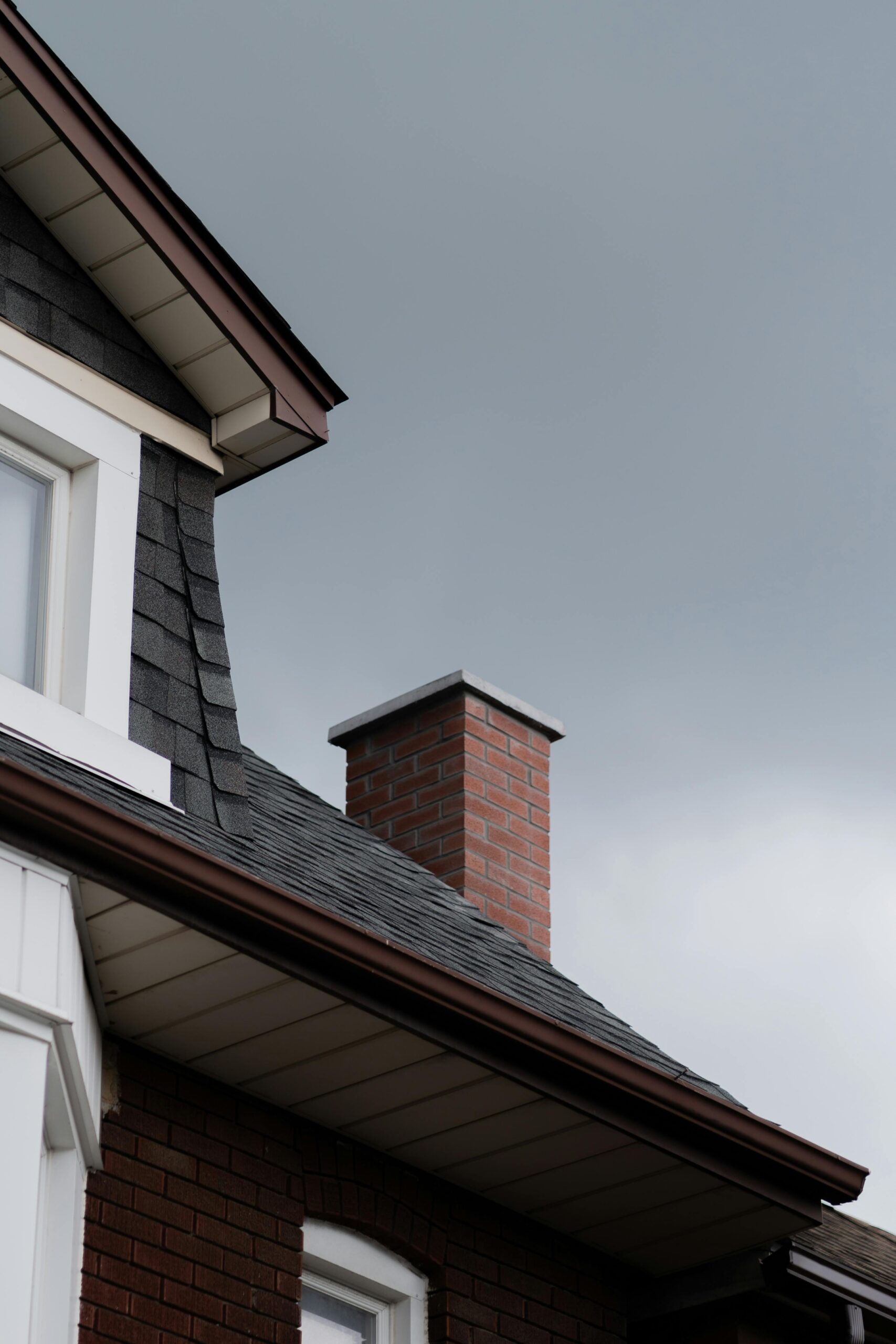 Brick chimney on slate roof