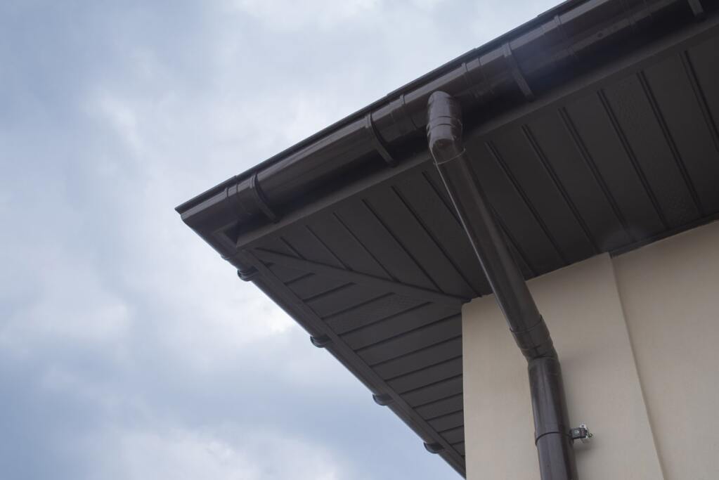 Roof fascia with downspout detail