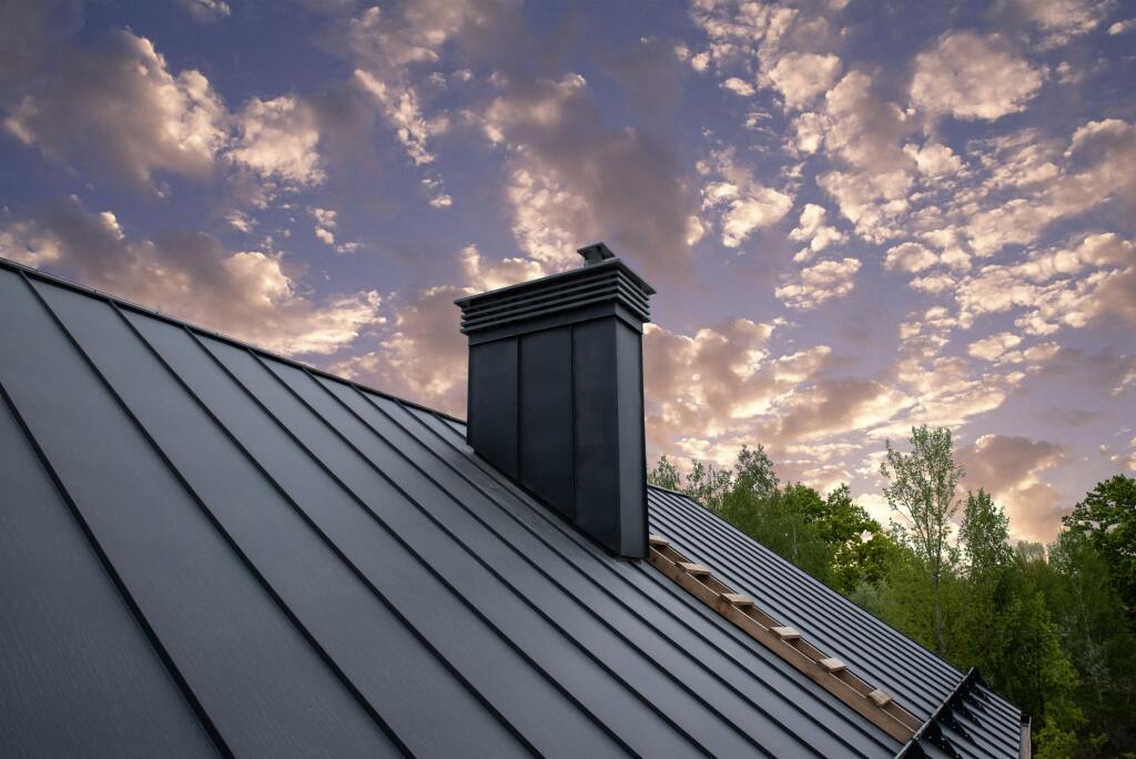 Metal roof under a colorful sky.